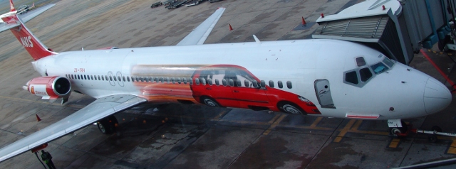 Avis Car Hire advertising on the side of the 1time plane