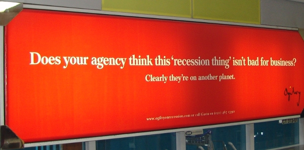 Ogilvy ad behind 1time check-in at Cape Town Airport