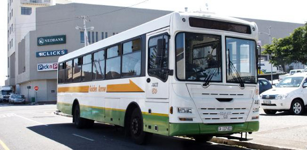 A white Golden Arrow bus