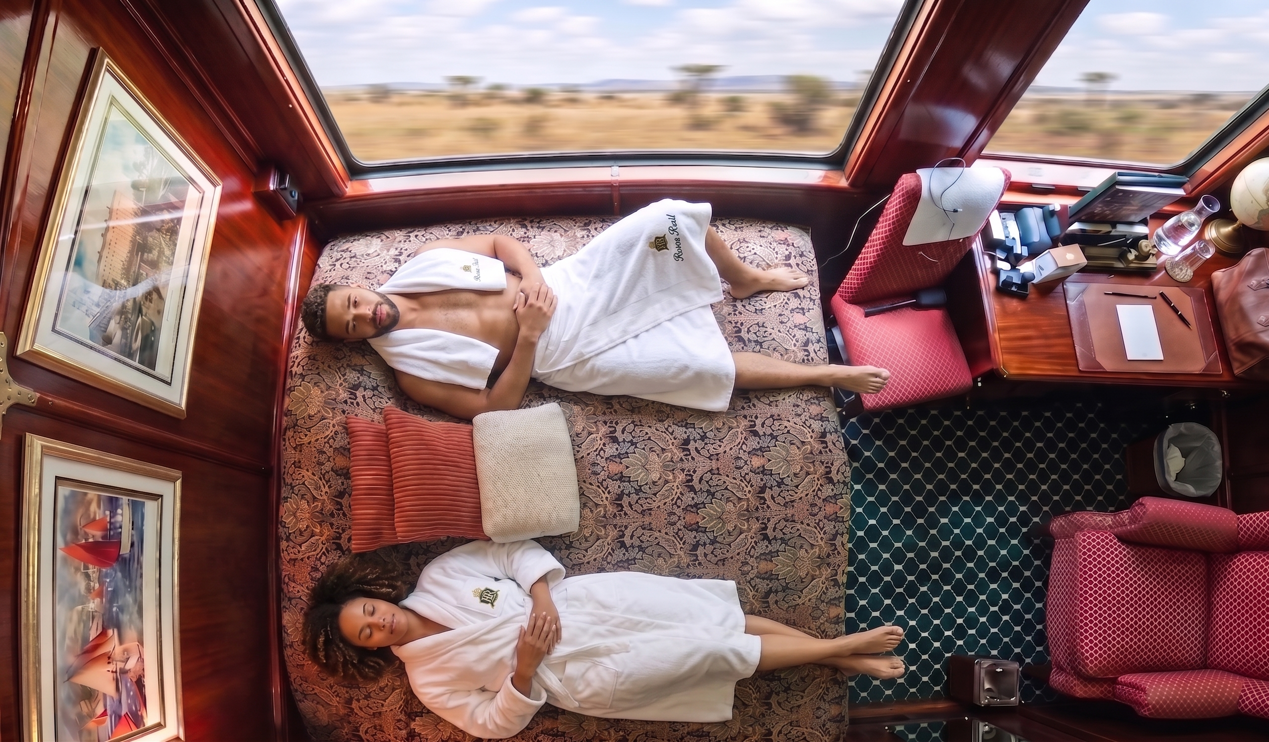 View from above of couple lying on a deluxe suite bed